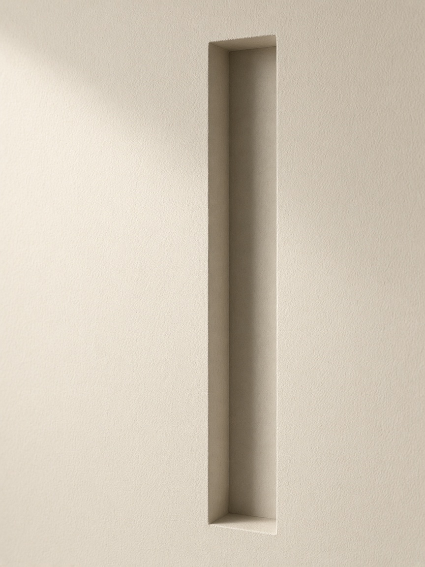 Deep recessed ivory architectural board under directional side light.
